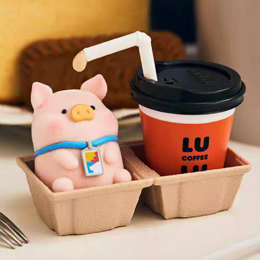 Pink piggy with a straw and an orange coffee cup labeled 'LU Coffee' on a tray.