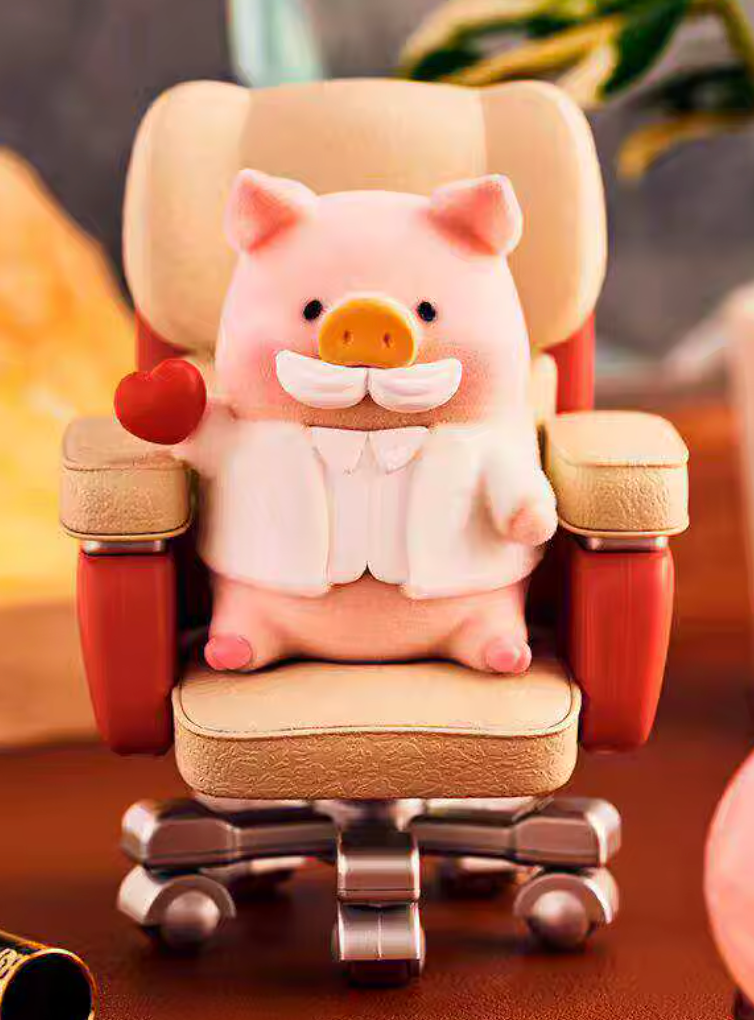 Plush pig toy sitting on a office chair with a blurred background