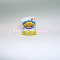 Small figurine of a cartoon character shaped like a bag on a gray background