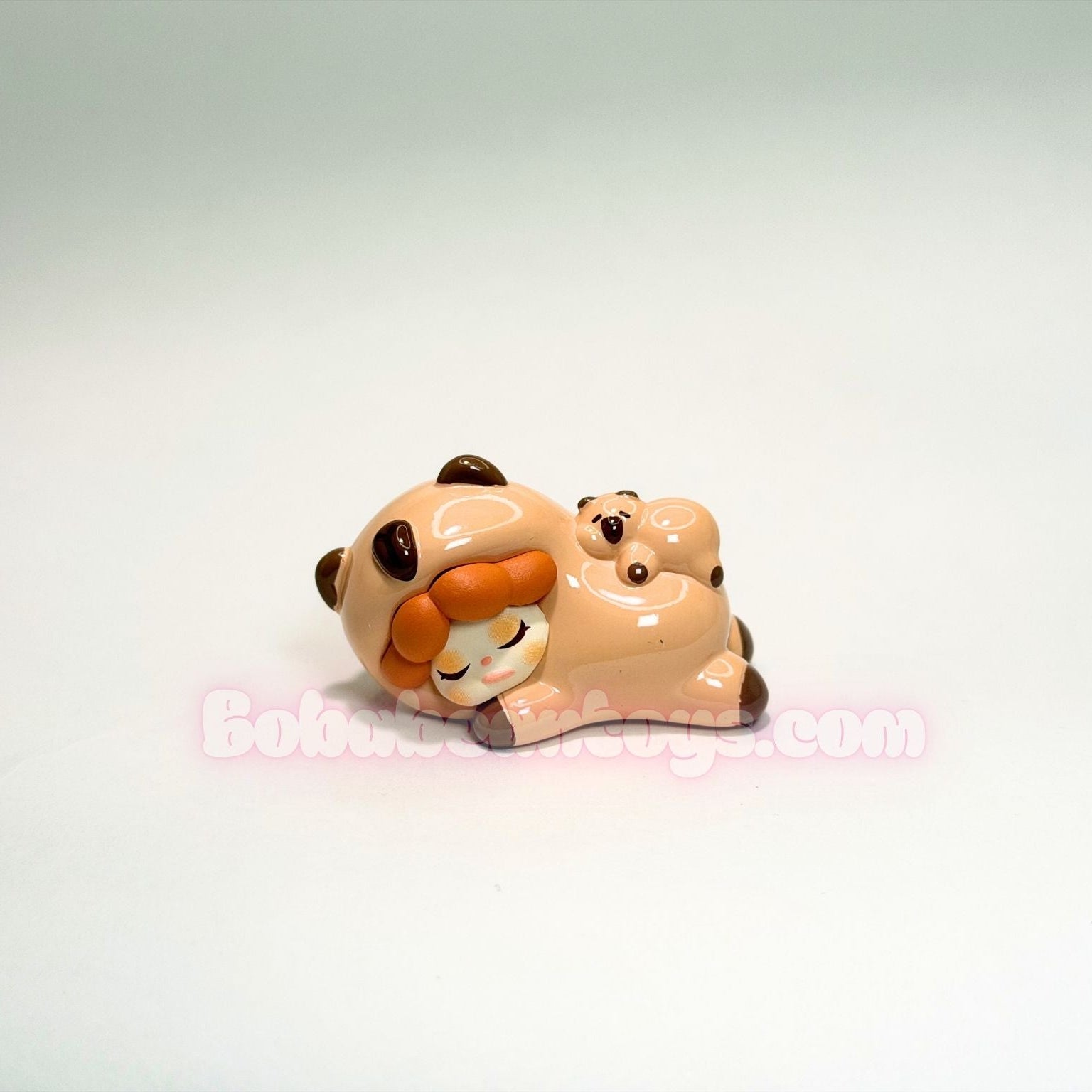 Small capybara character with a cub on a white background