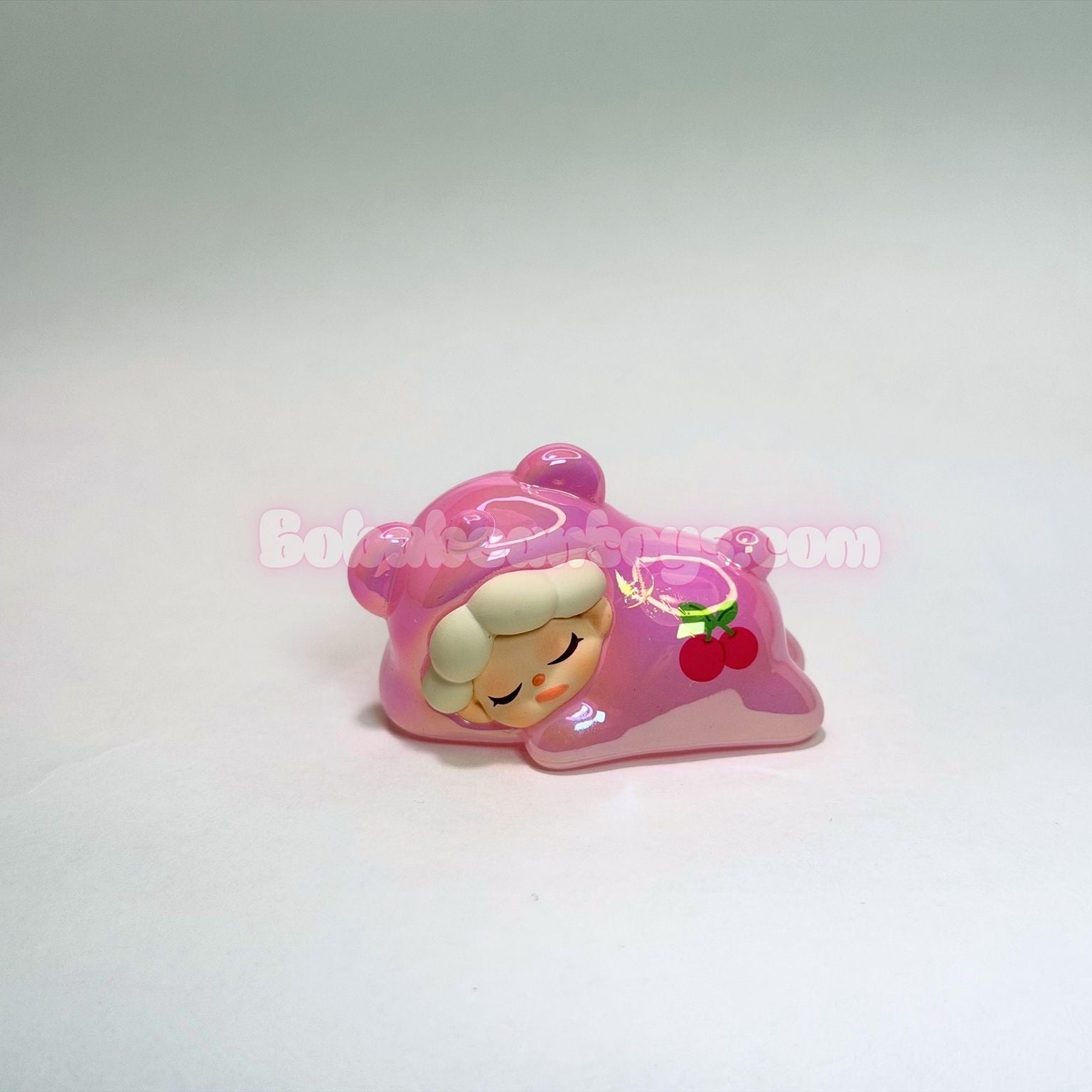 Pink bear character on a white background