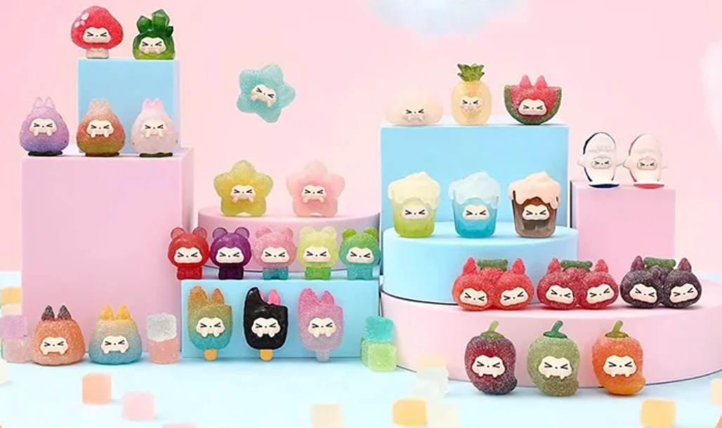 Colorful cartoon-like figurines on a pink background