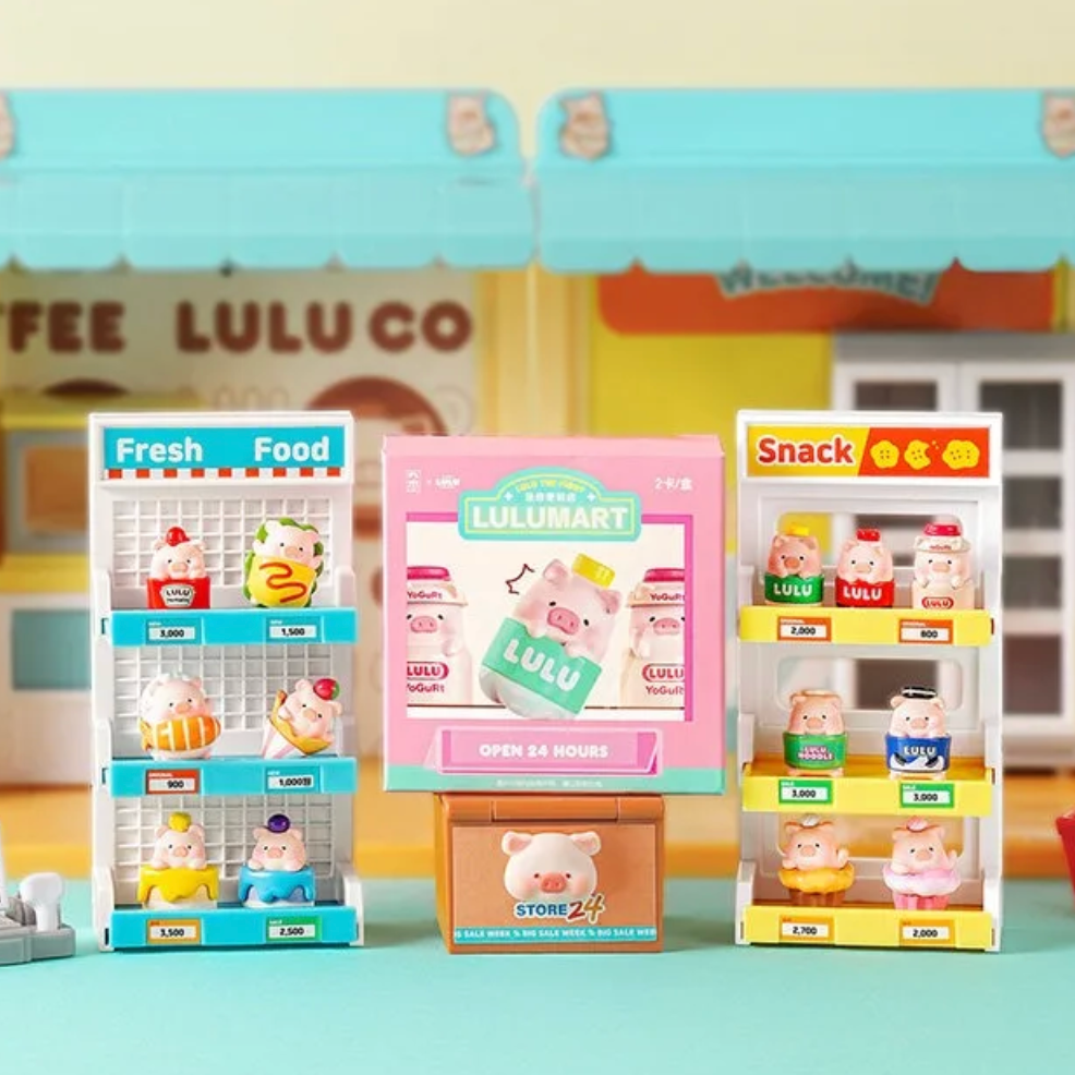 Toy store with miniature shelves and a toy cash register on a light blue surface.