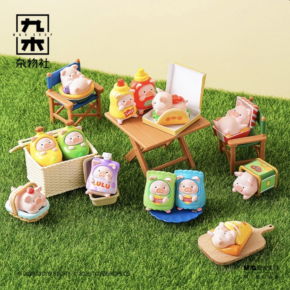 Set of toy figures and accessories on a grassy surface with a neutral background