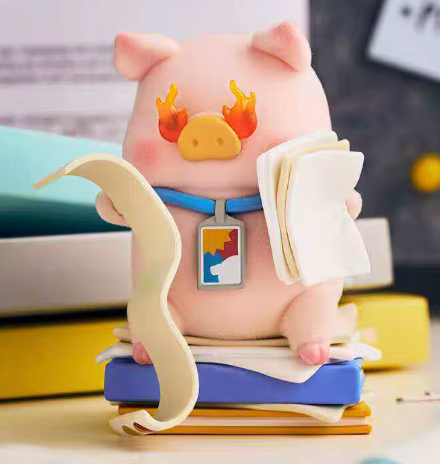 Cartoonish pig figurine with a blue belt and colorful tag on a blurred background