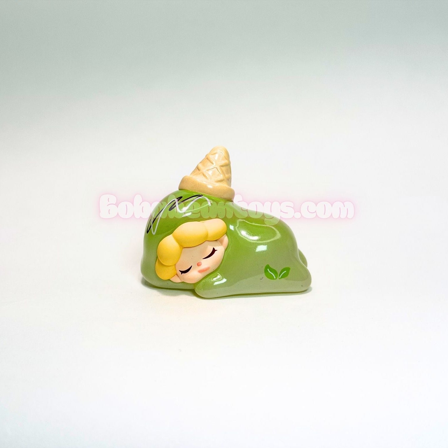 Green ice cream character on a white background.