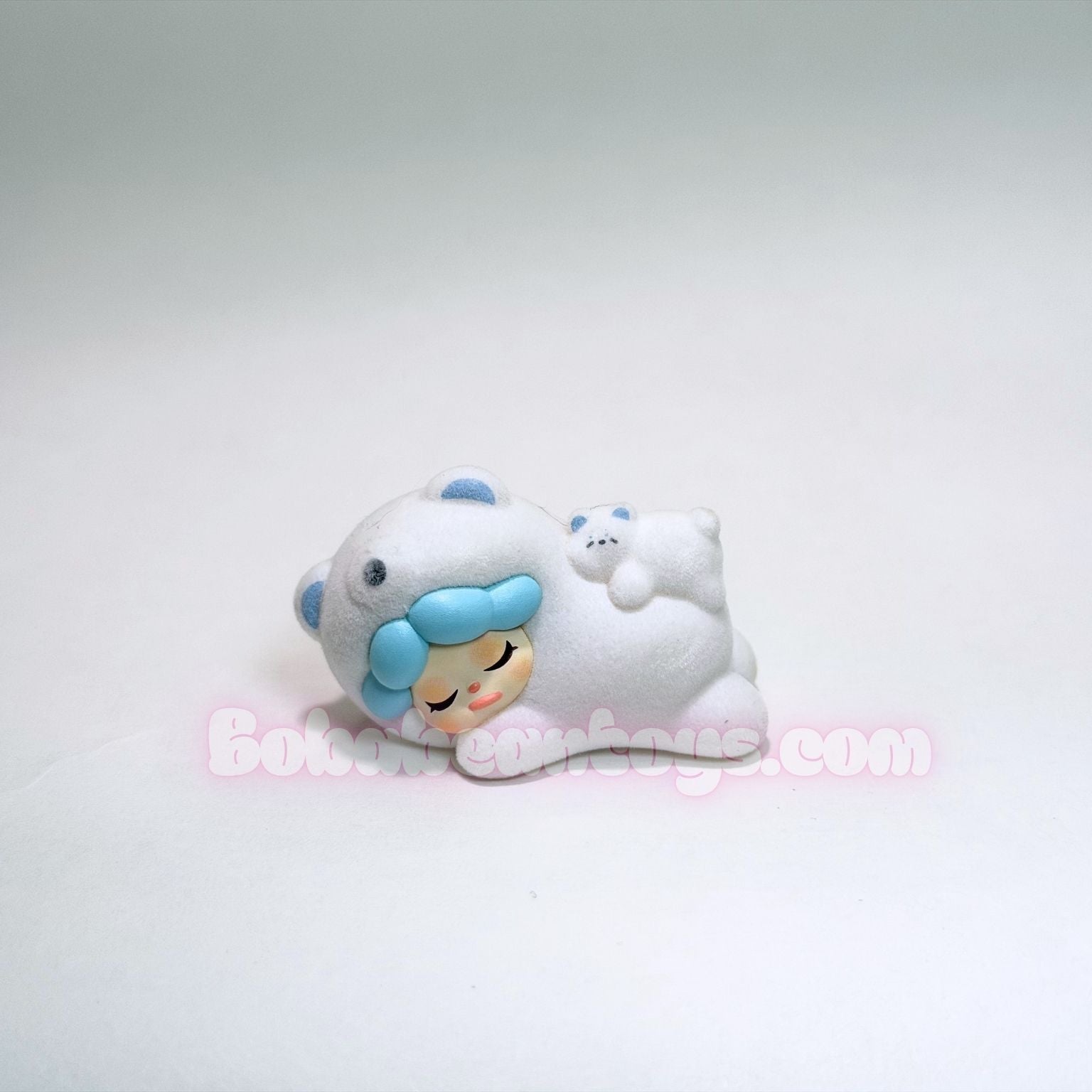 Small figurine of a polar bear on a white background