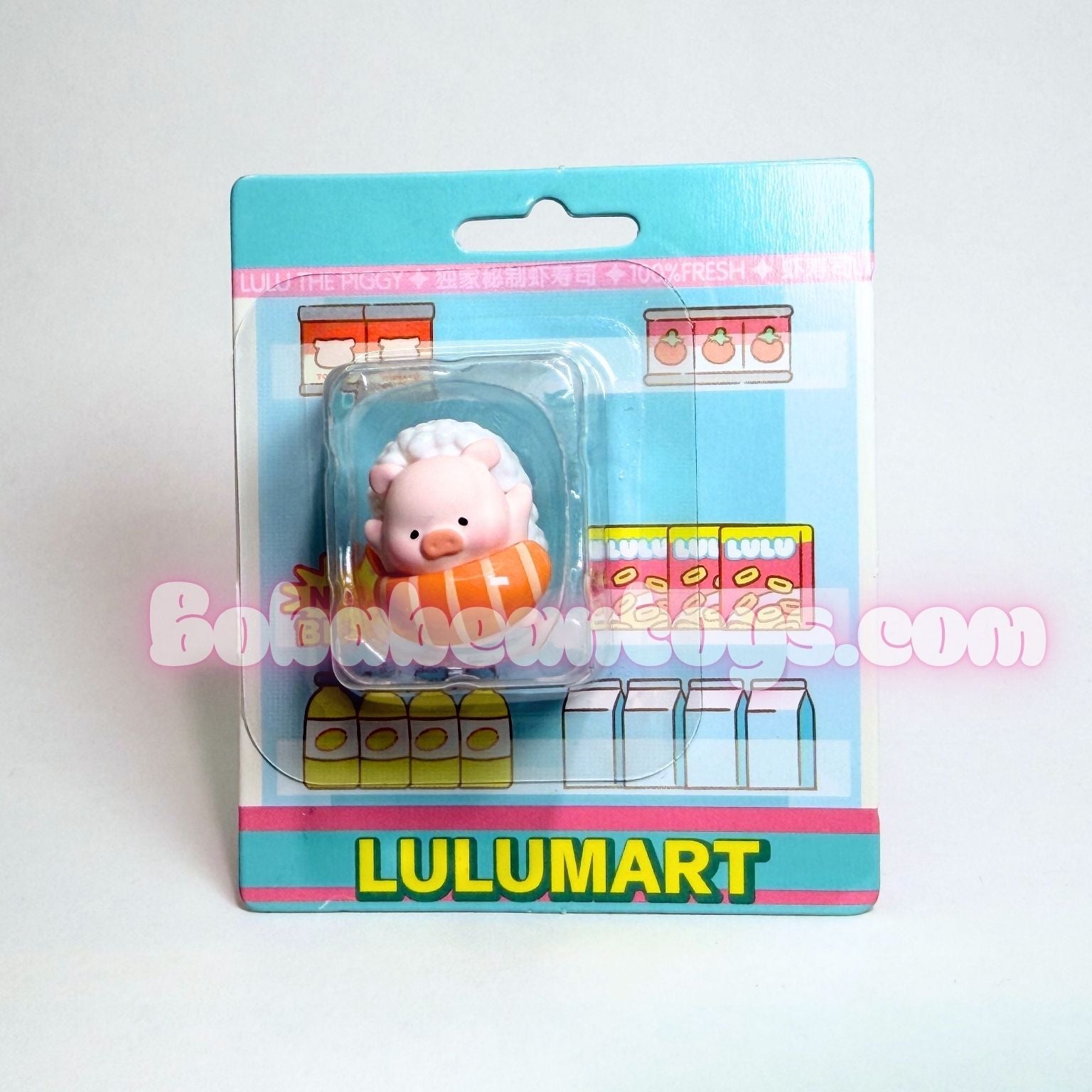 Toy figure in packaging with Lulumart branding on a white background