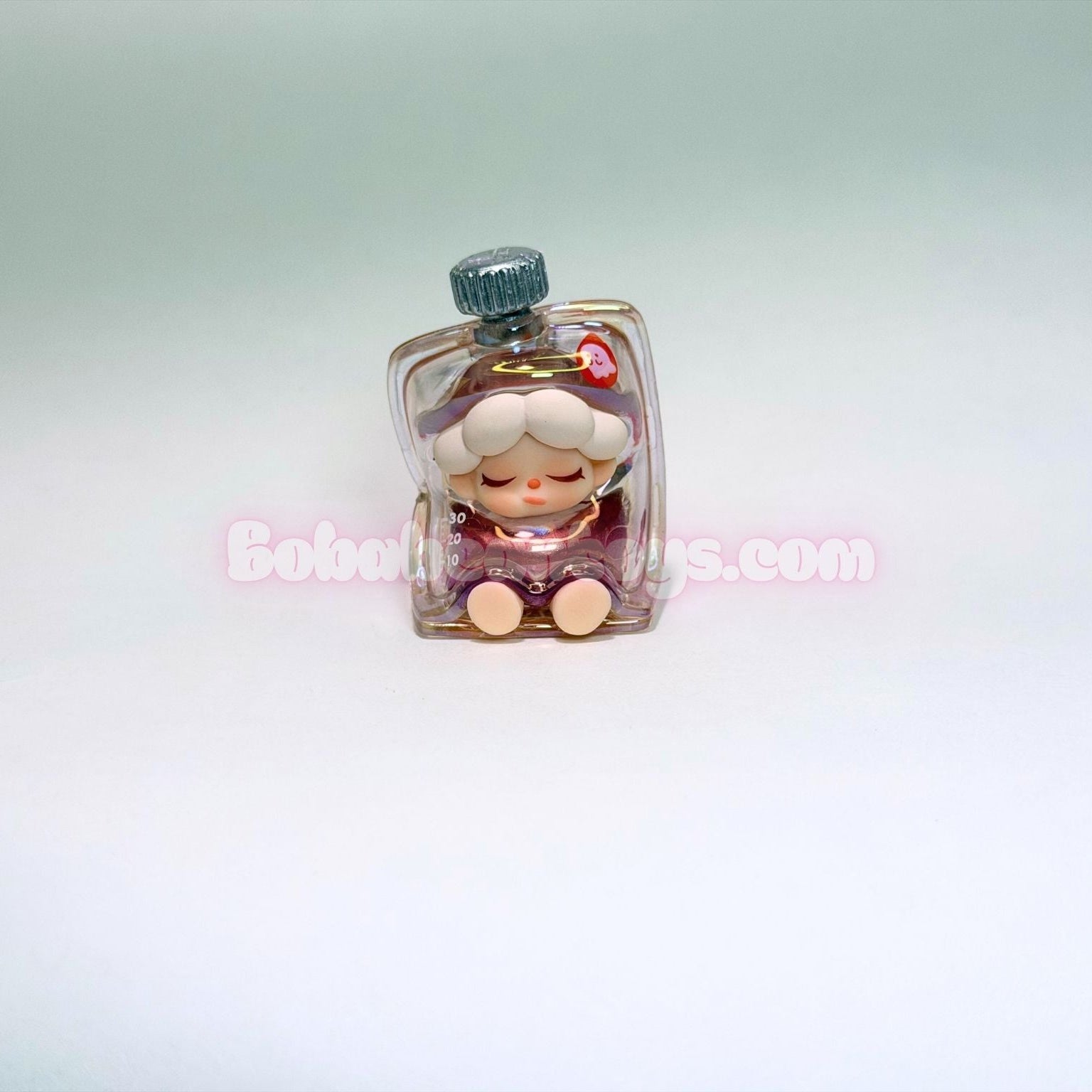 Small figurine of a character with a bottle on a light gray background