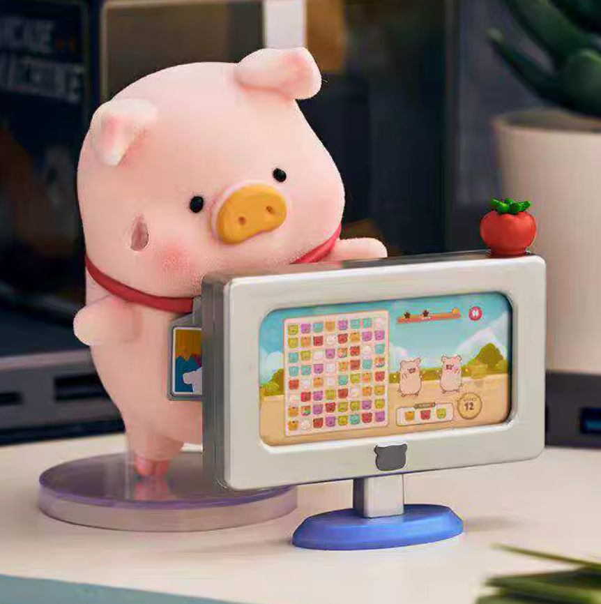 Plush pig toy with a small TV screen displaying cartoon content on a desk.