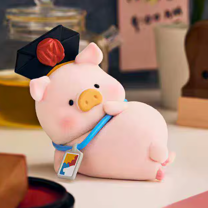 Cute pink pig plush toy with a cap and lanyard on a blurred background