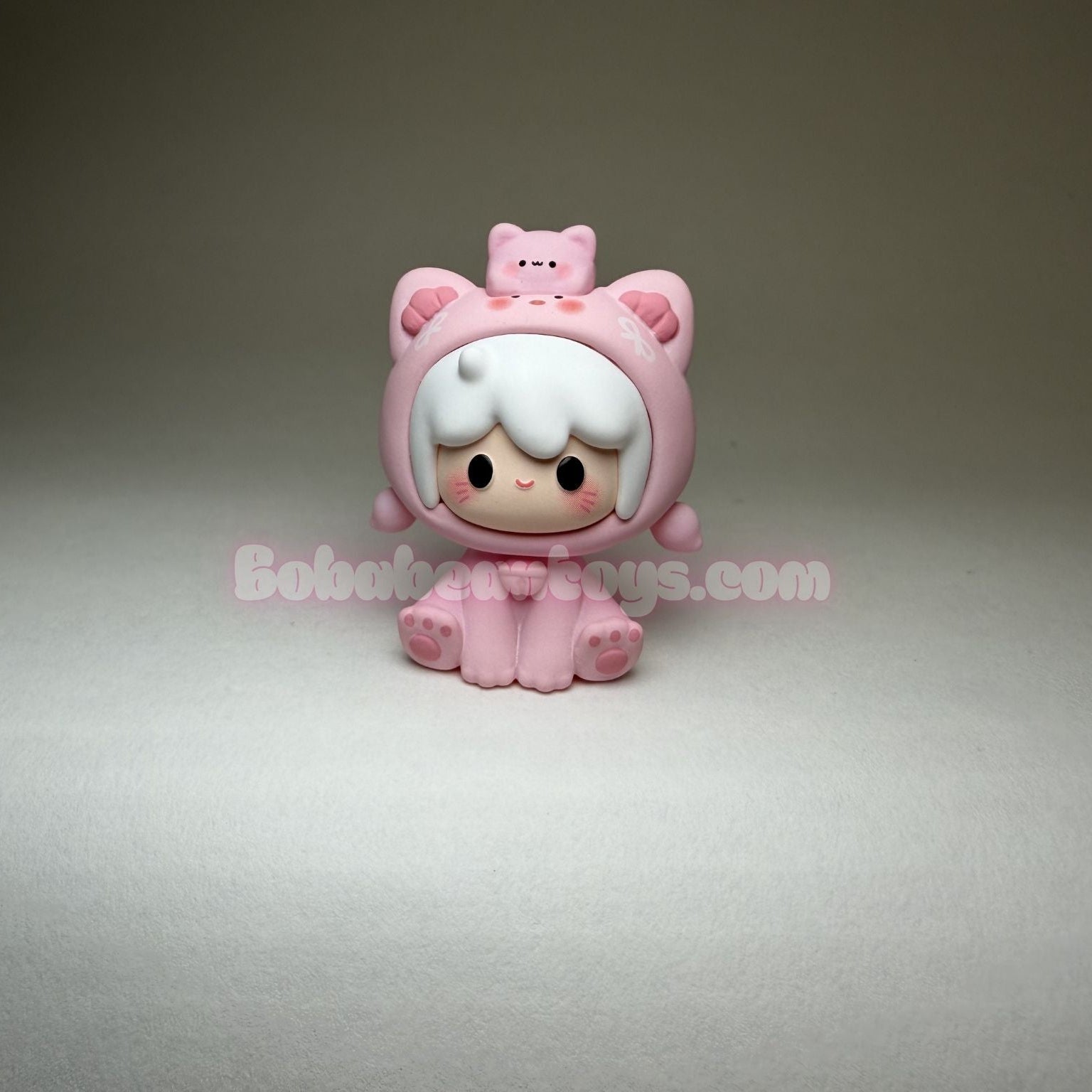 Pink cartoon-like figure with a small pink cat on a gray background