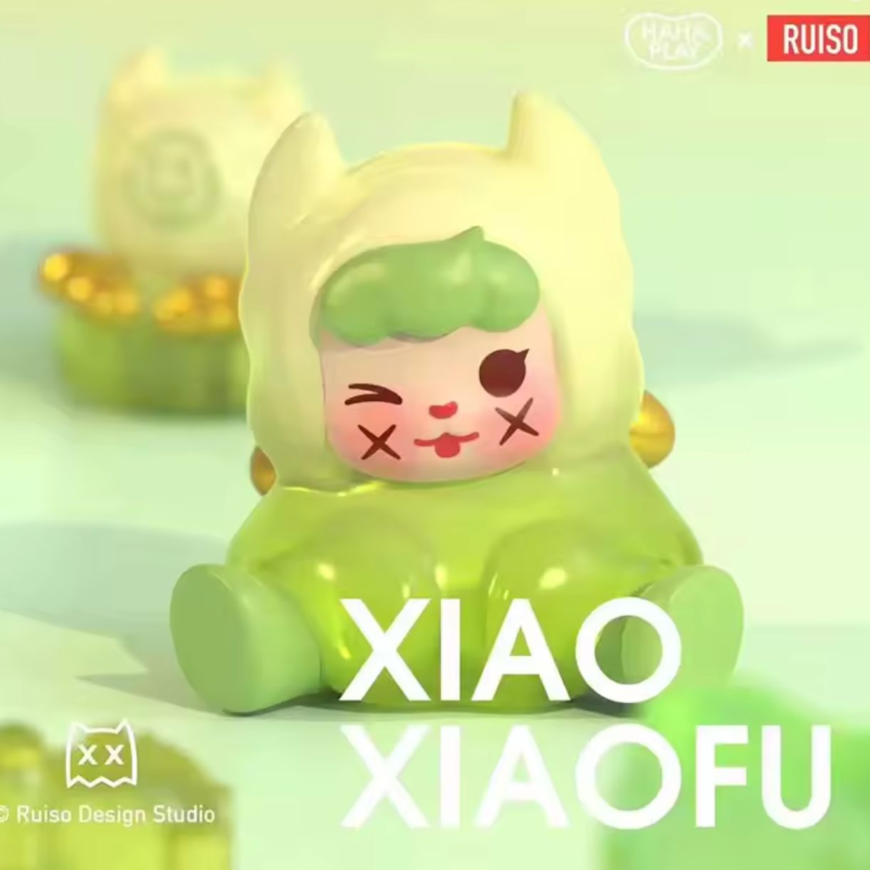 Green toy with cartoon face on a light green background, featuring the brand 'RUISO'.