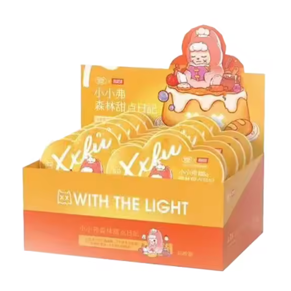 Display box of 'Xiaoxiao' snacks with cartoon character on top, featuring text 'WITH THE LIGHT'.